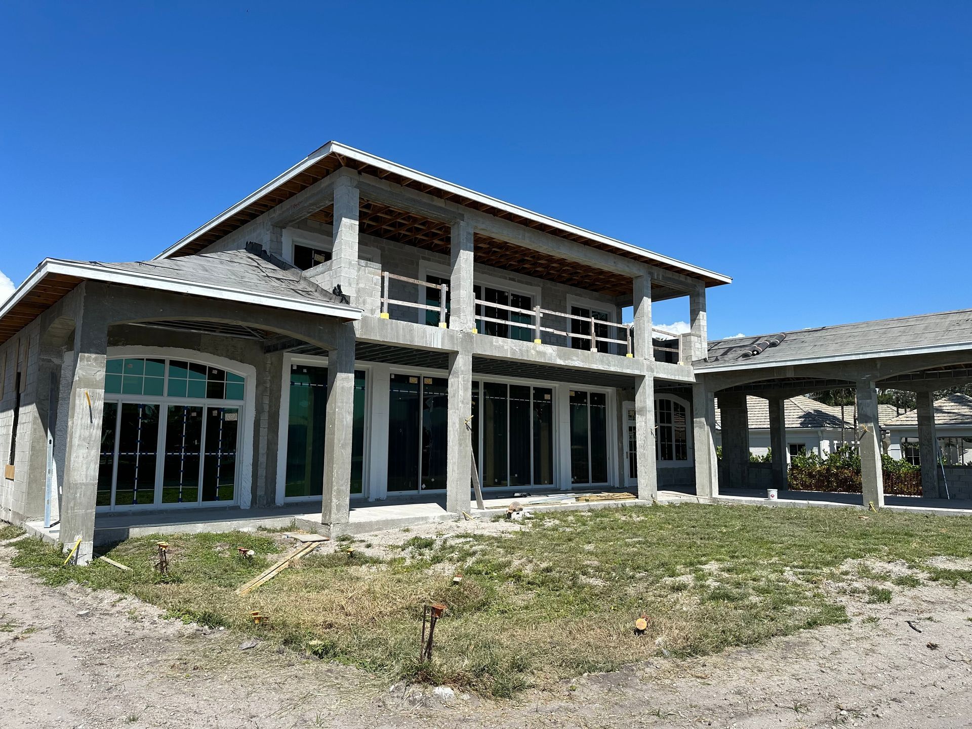 A white house with a garage and a lot of windows