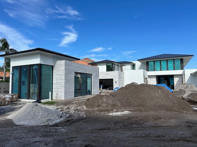 A house with a palm tree in front of it