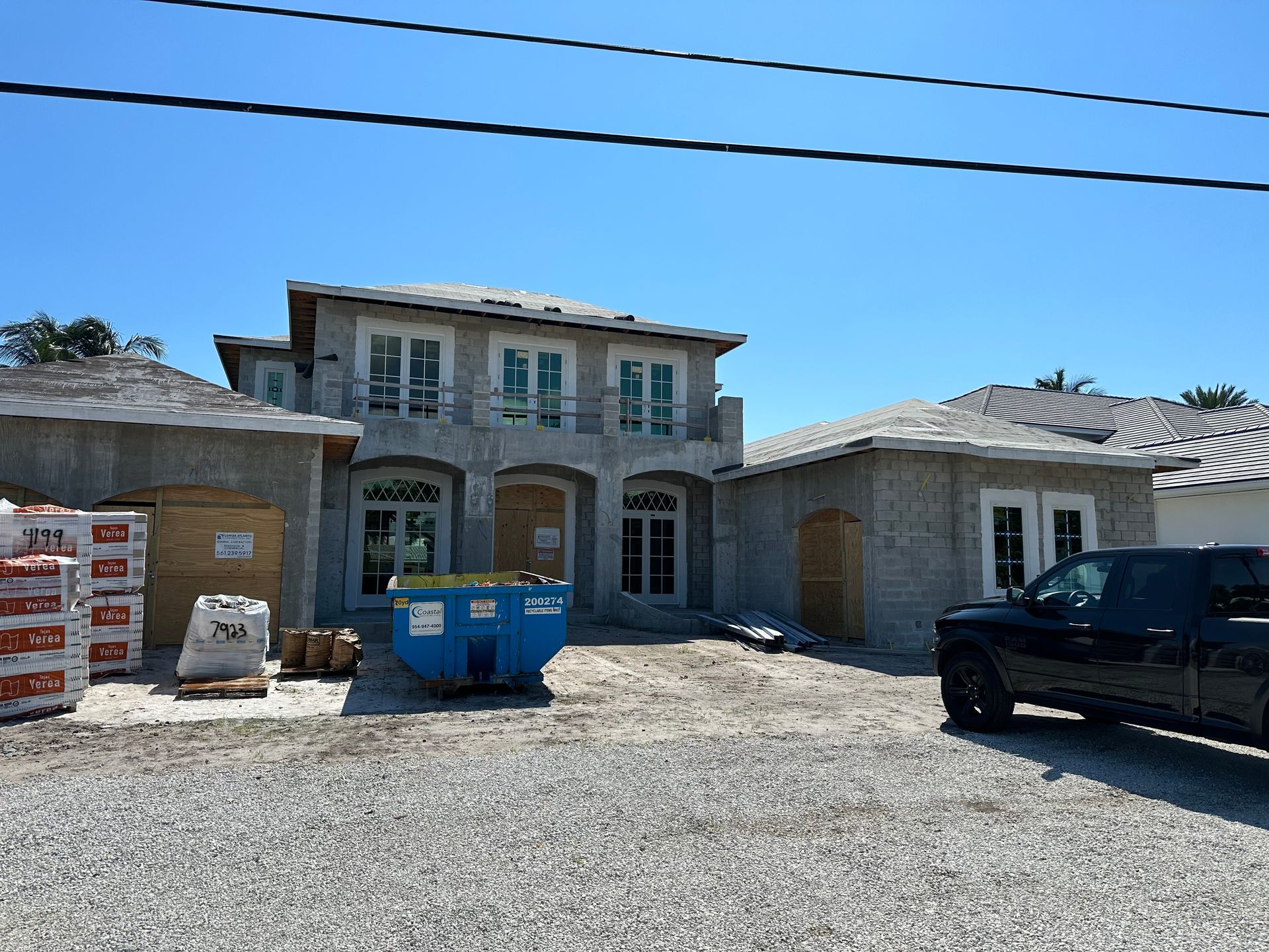 The front door of a house with a covered walkway leading to it