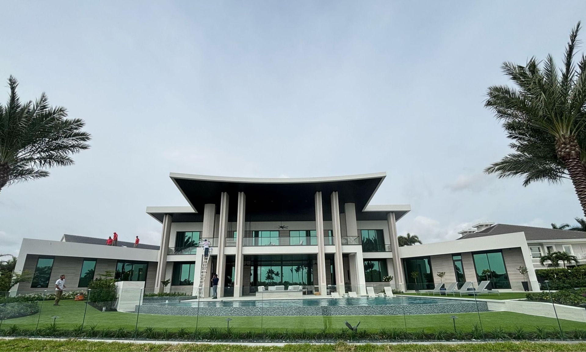 A large house with palm trees in front of it