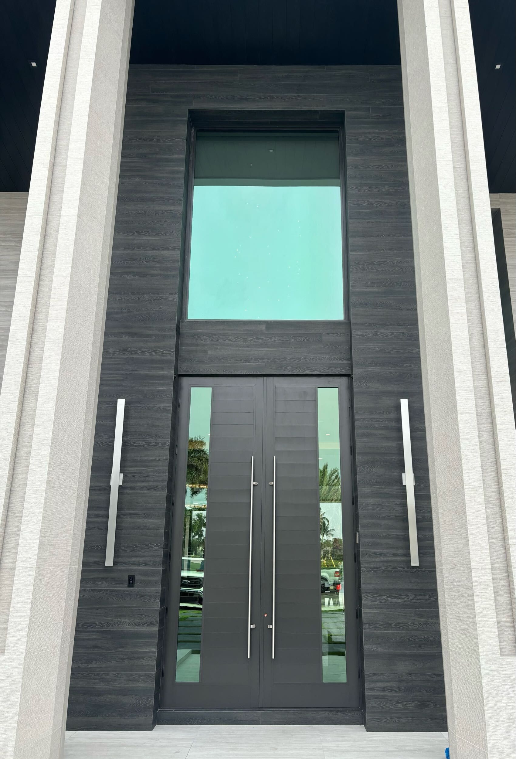 The front door of a building with a large window