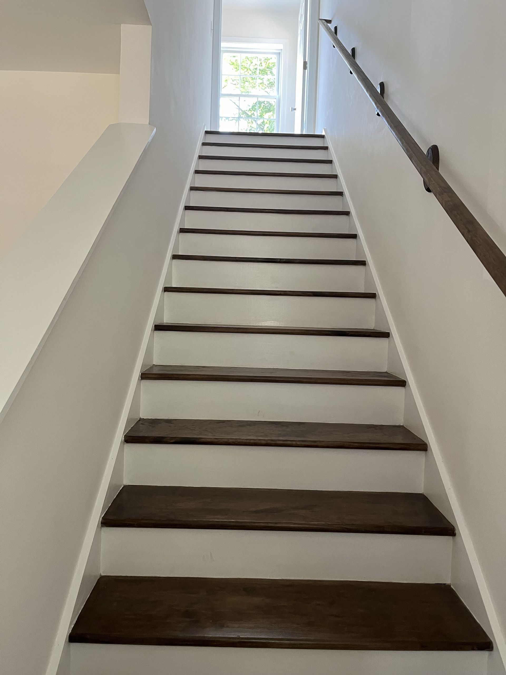 A set of stairs leading up to the second floor of a house