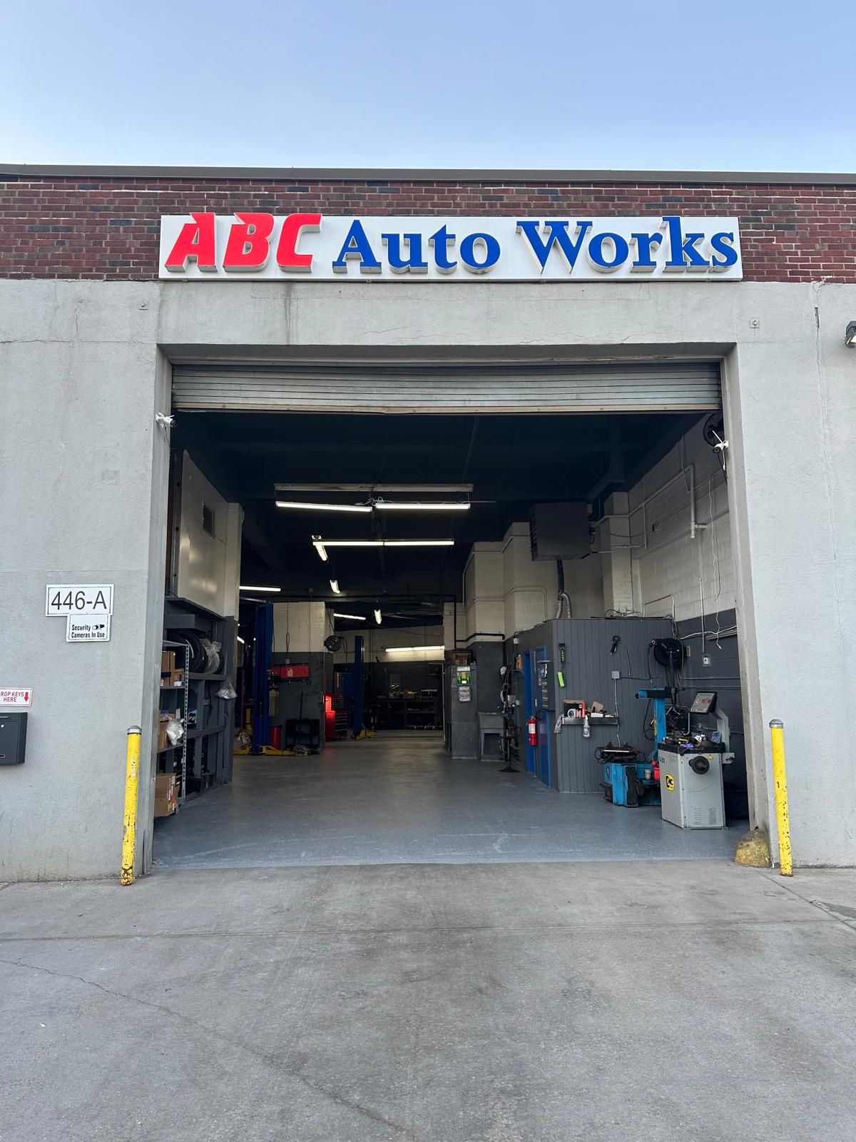 ABC Auto Works shop exterior with open garage door.