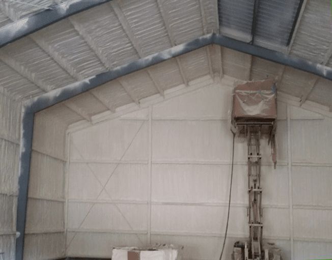 a large building with a roof that is covered in foam