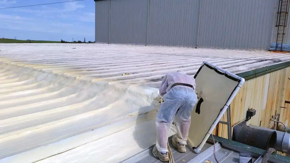 a man is working on the roof of a building