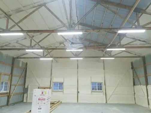 a large warehouse with a box in the middle of it