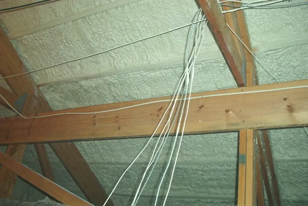 a ceiling with a lot of wires hanging from it