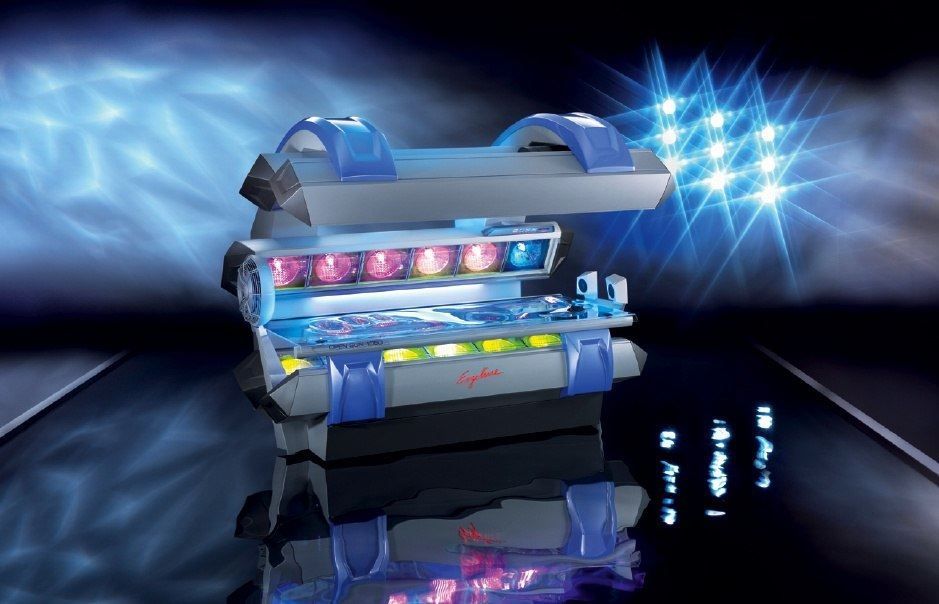 Futuristic blue robotic device with glowing lights on a reflective dark surface