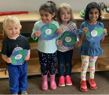 A group of children are standing next to each other