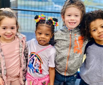 A group of children are posing for a picture together