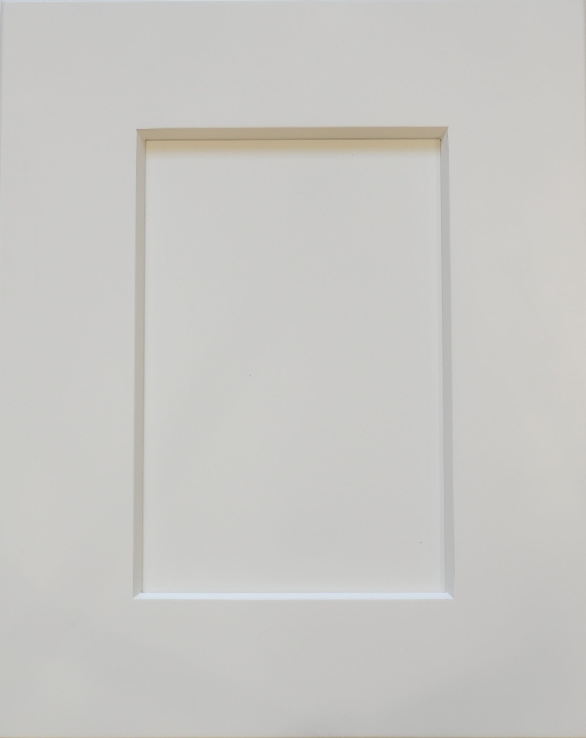 Blank white recessed wall panel with a thin beige border and subtle shadow.