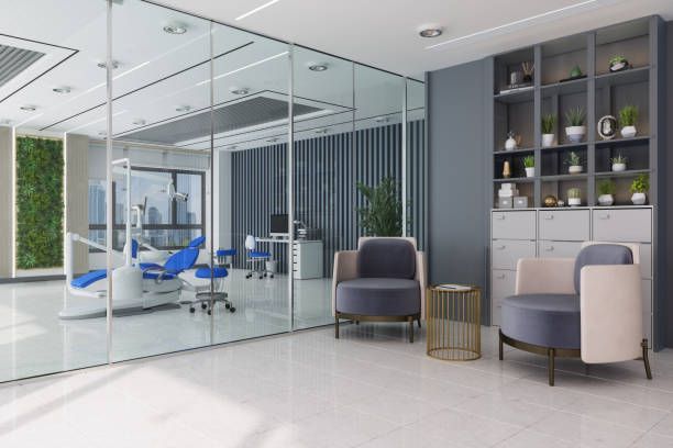 A dental office with a dental chair and chairs in it.