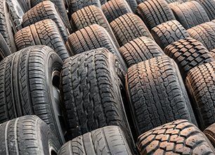Stacks of old used tires for sale