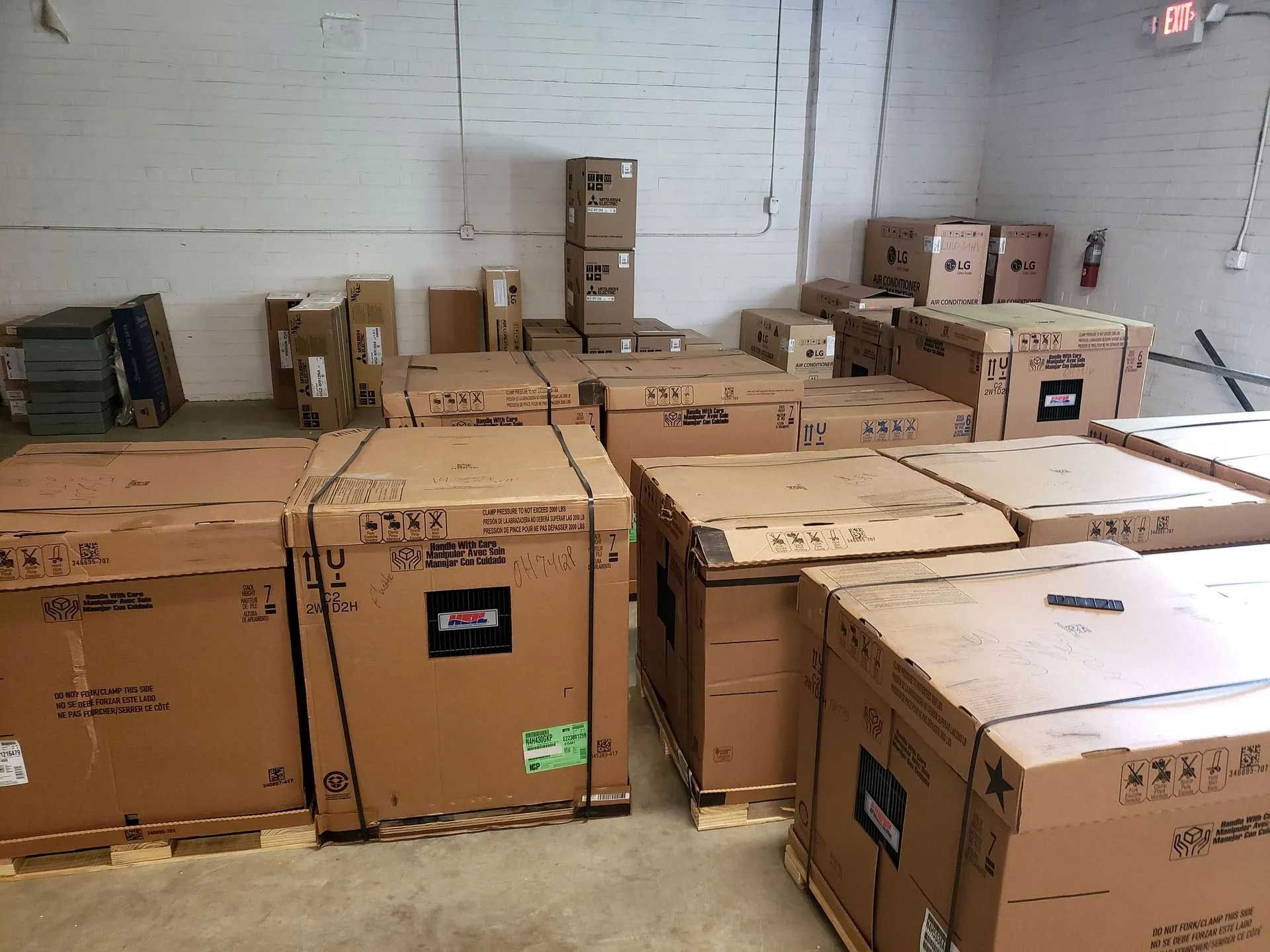 Warehouse filled with stacked cardboard boxes on pallets.