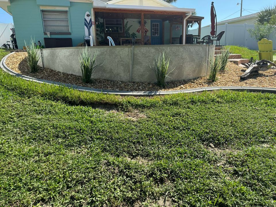 A house with a large lawn in front of it.