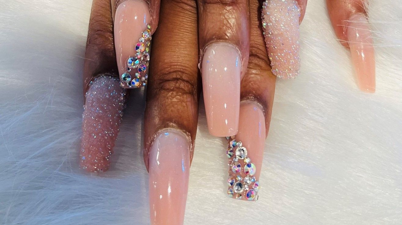Finger nails design with shiny glitter and stones