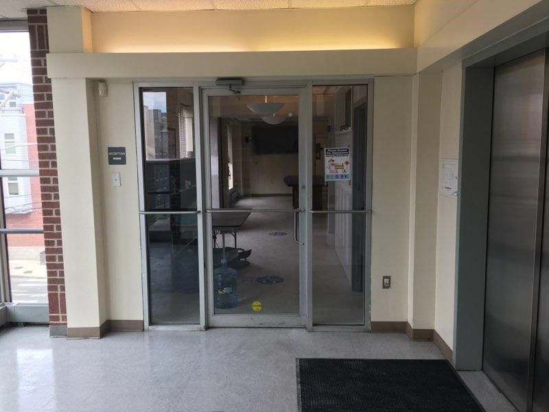 A lobby with a sliding glass door.