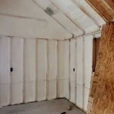 Interior room with spray foam insulation on walls and ceiling.