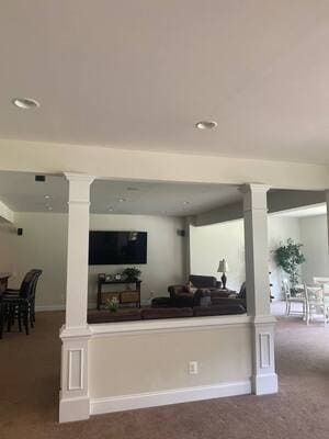 A living room filled with furniture and a flat screen tv.