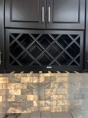 A wine rack is built into the wall of a kitchen.