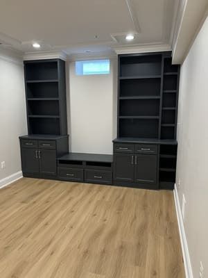 A room with a lot of shelves and cabinets in it.