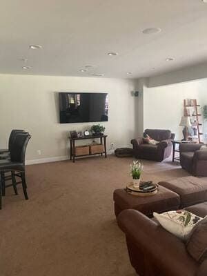 A living room filled with furniture and a flat screen tv.