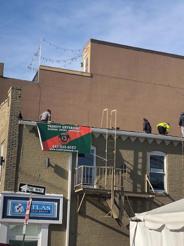 Workers on the roof working on a commercial building
