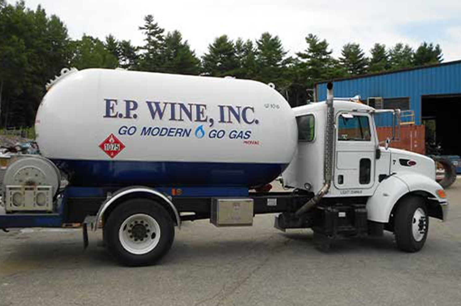 White and blue propane truck with 