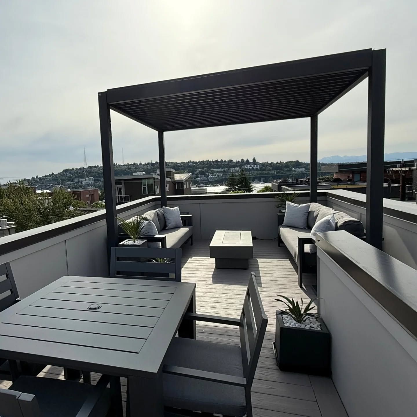 A wooden deck with outdoor seating