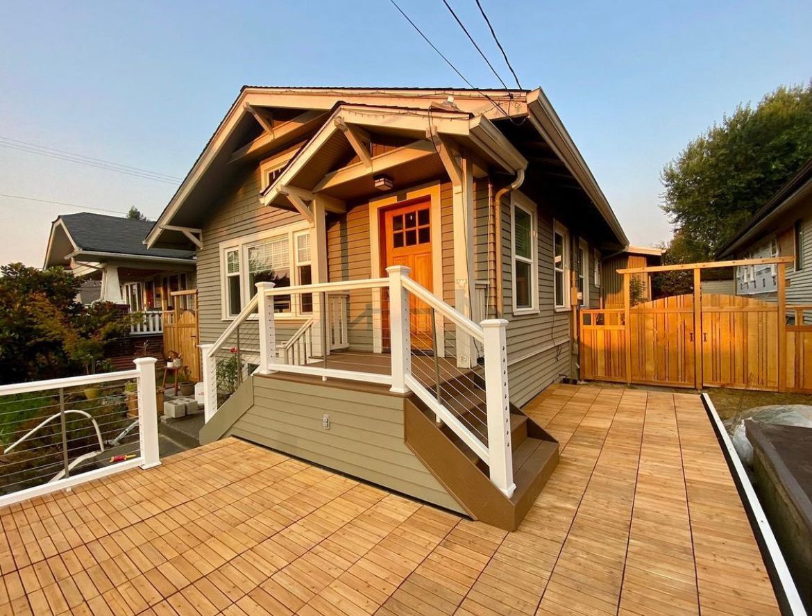 A small house with a porch and stairs