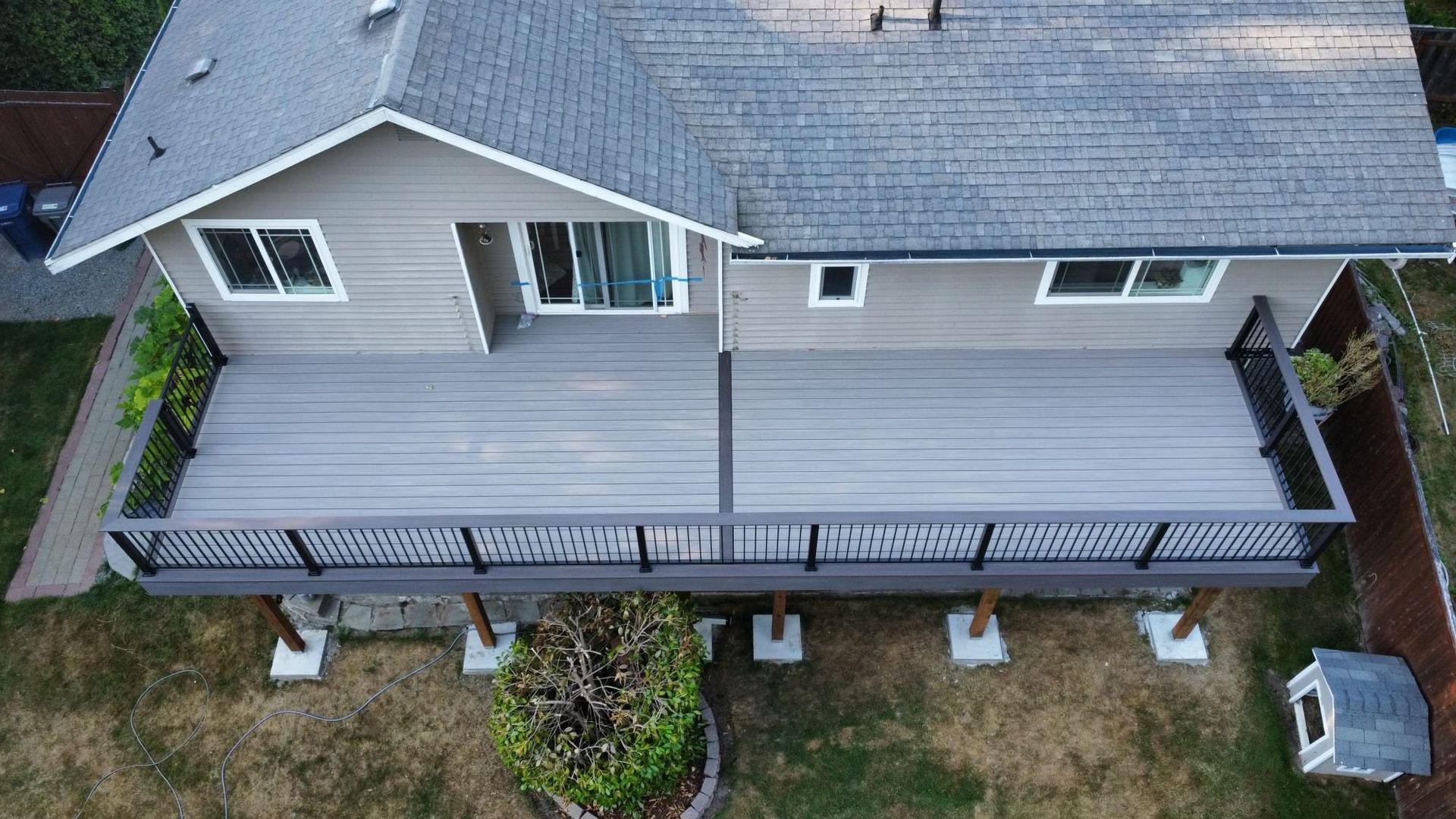 An aerial view of a house with a large deck.
