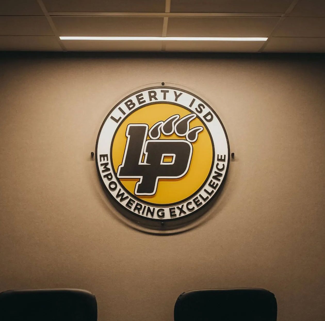 Liberty ISD logo on a wall.