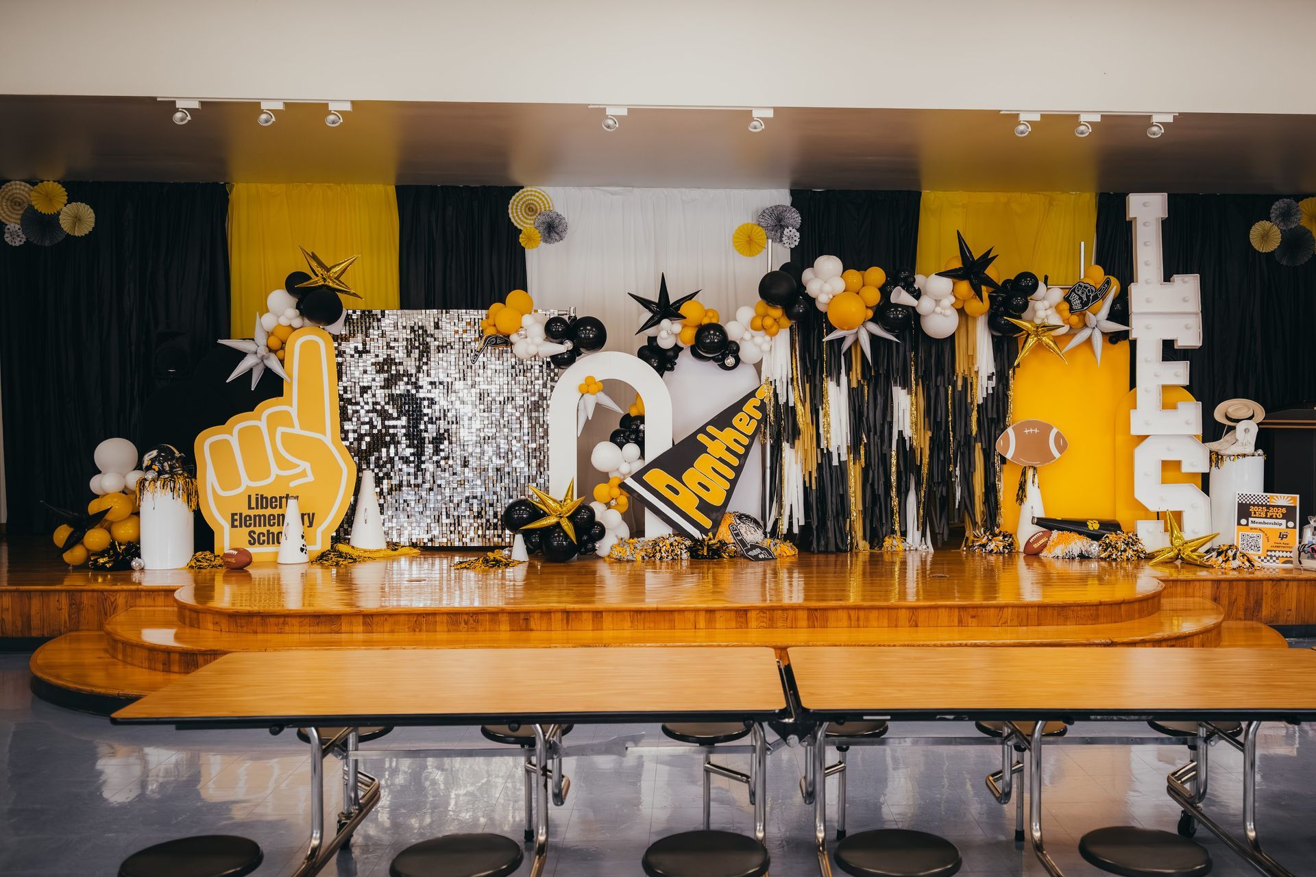Stage decorated in black and yellow for a party