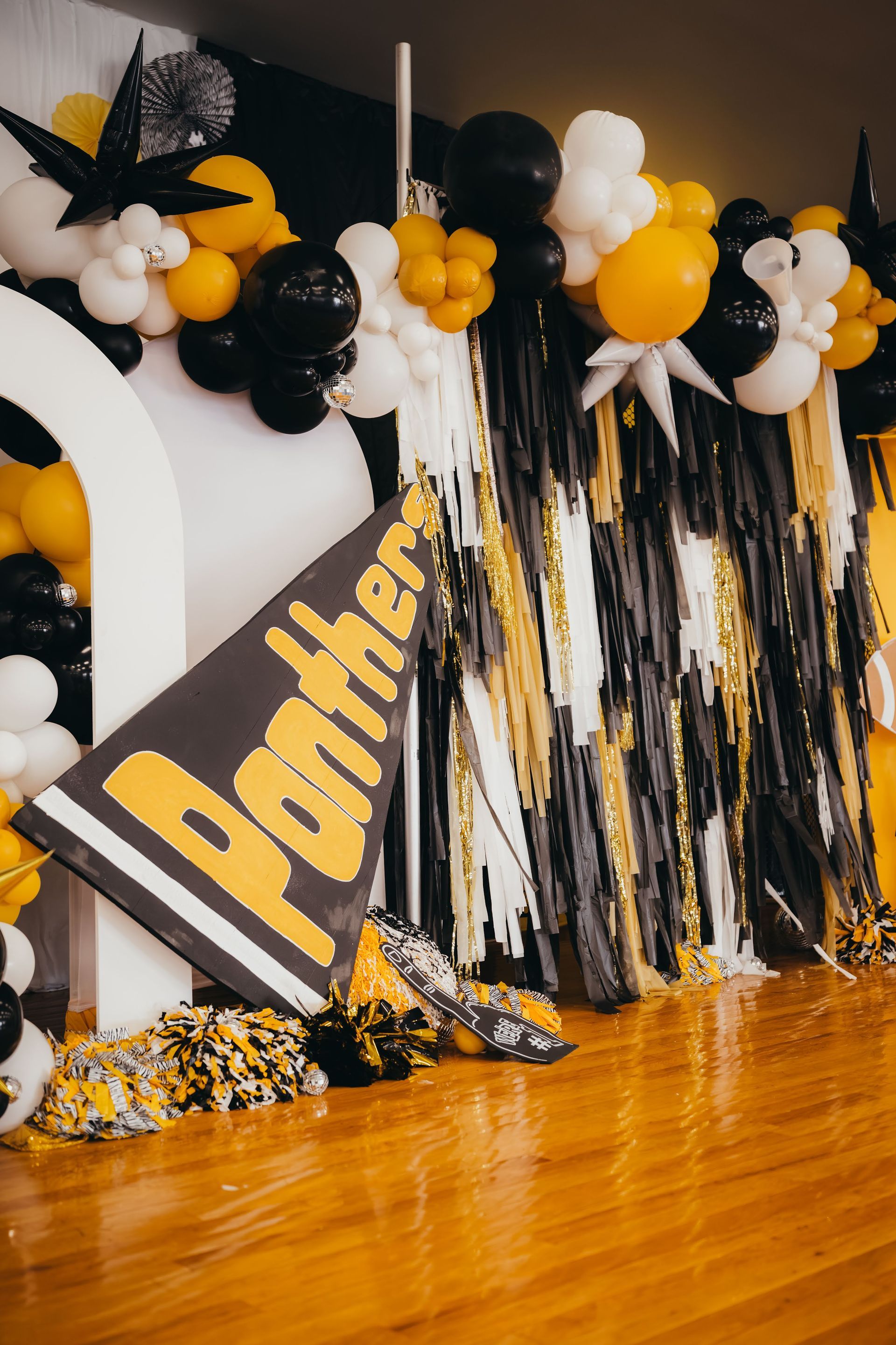 Black, white, and yellow balloon decorations