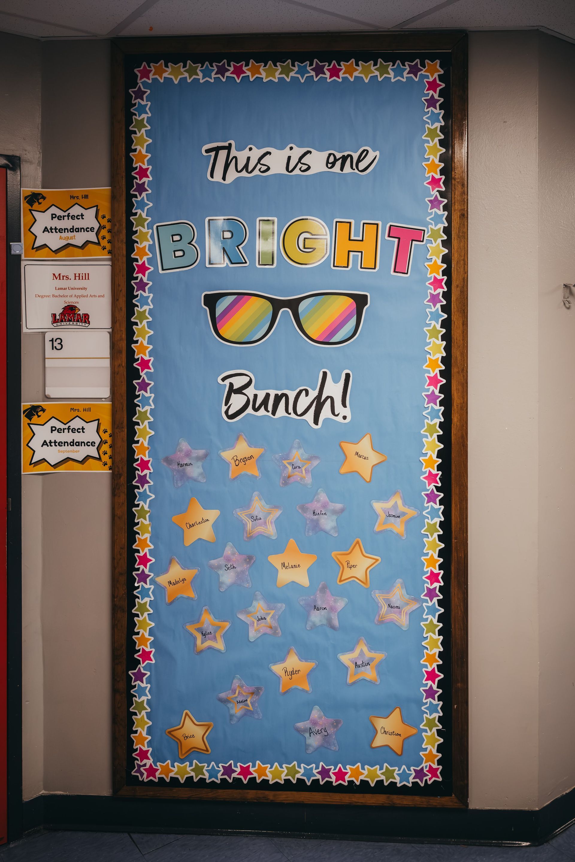 Classroom door with sunglasses, and star decorations.