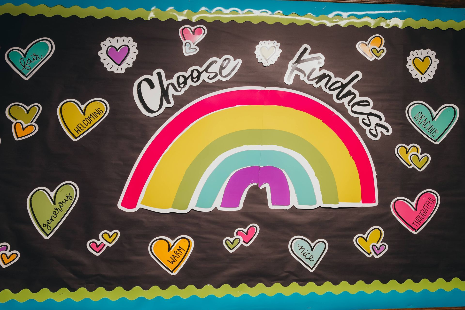 Bulletin board with rainbow and hearts 