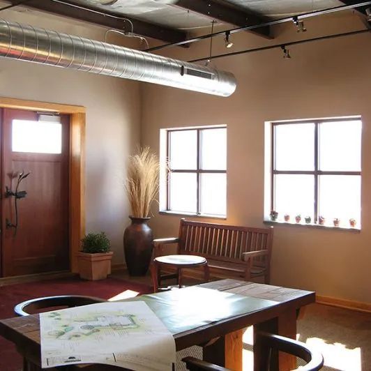 Cozy room with wooden table, bench, two windows, and a decorative vase near the door