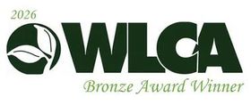 A green WLCA 2026 Bronze Award Winner logo with a leaf icon on a white background.