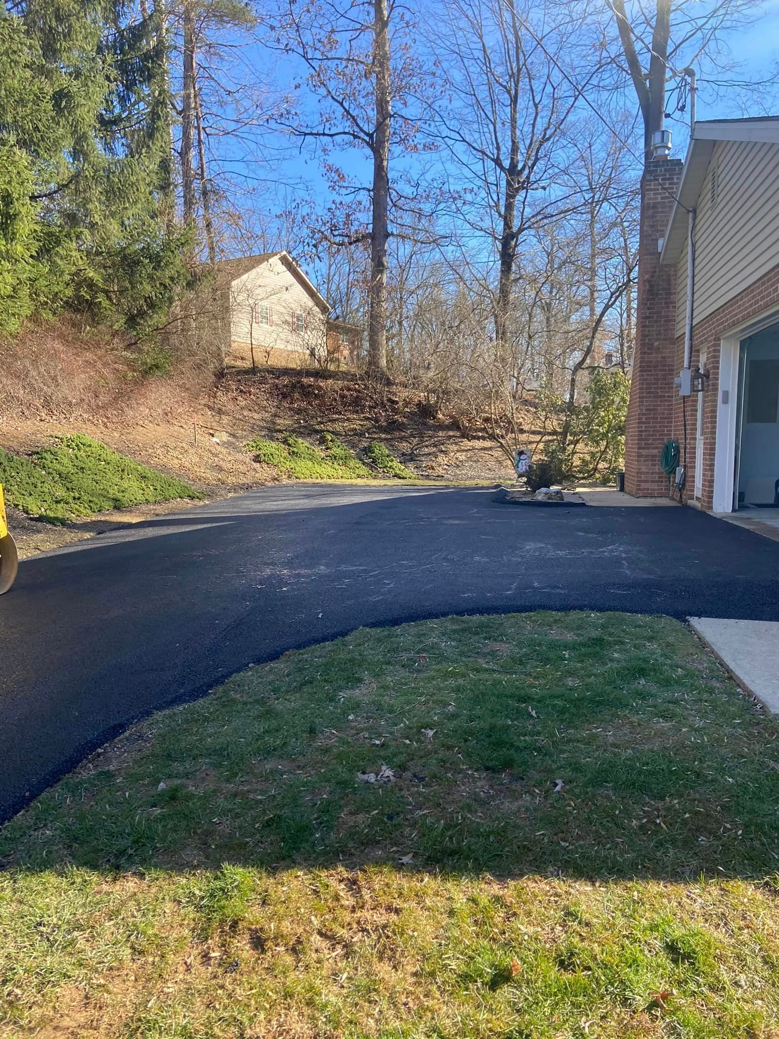 A driveway is being installed in front of a house.