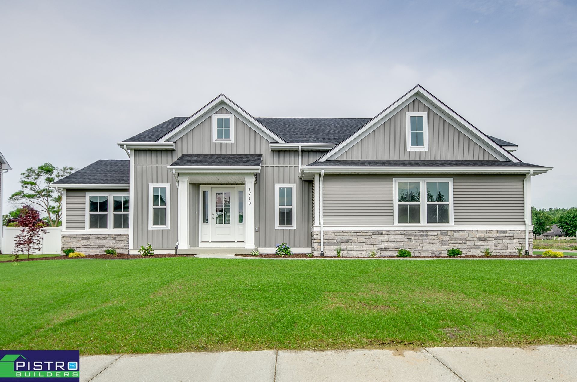 A large house with a lot of windows is for sale