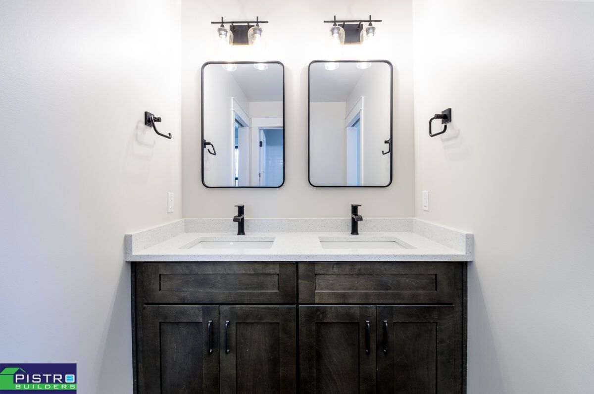 Two mirrors and bathroom sink