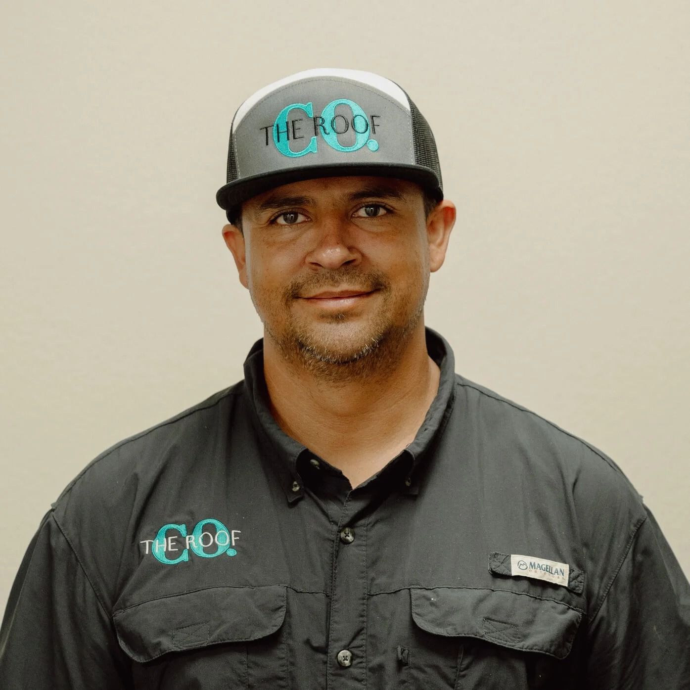Man wearing a trucker hat and shirt with 