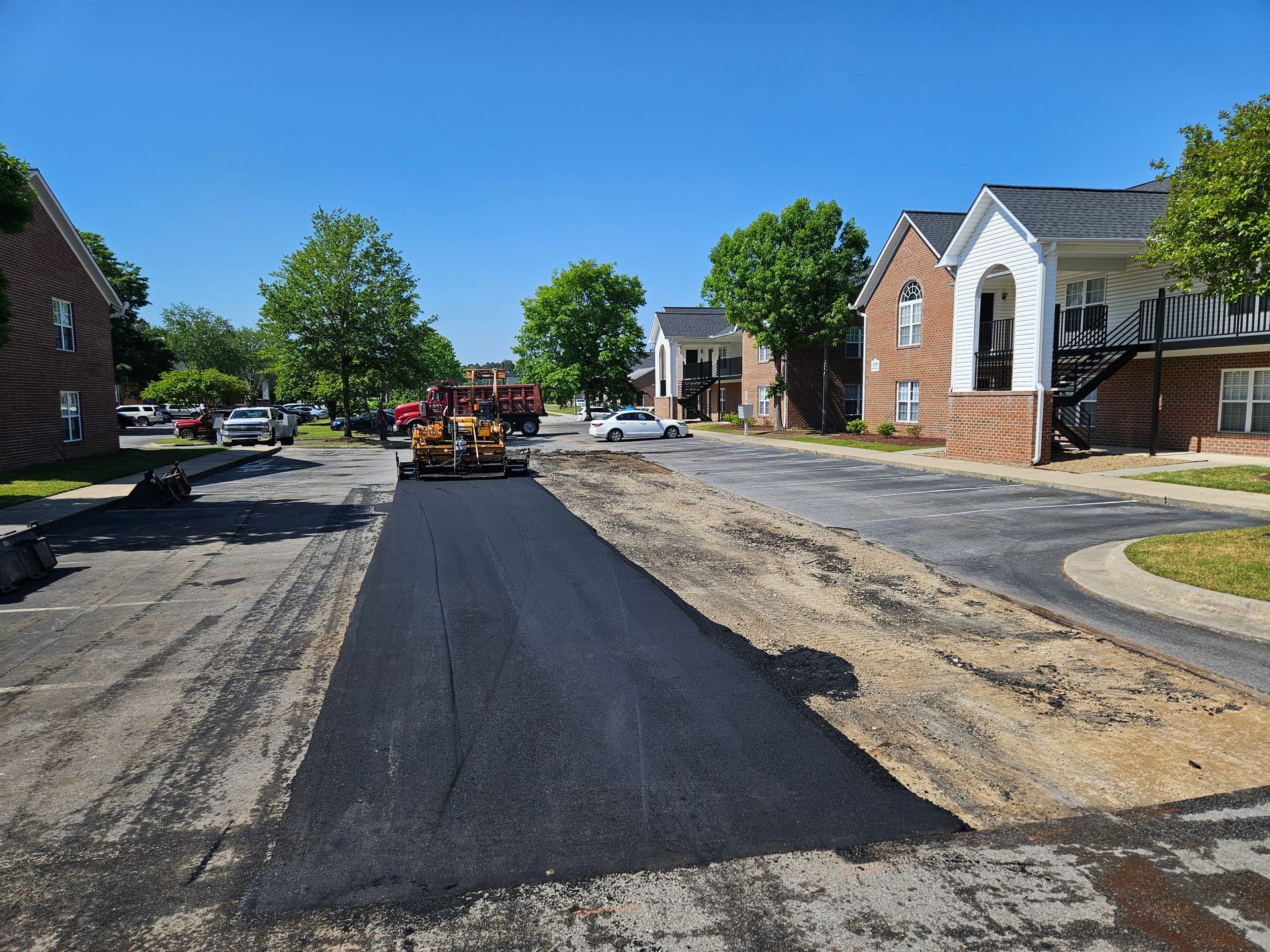 A road is being paved in a residential area.
