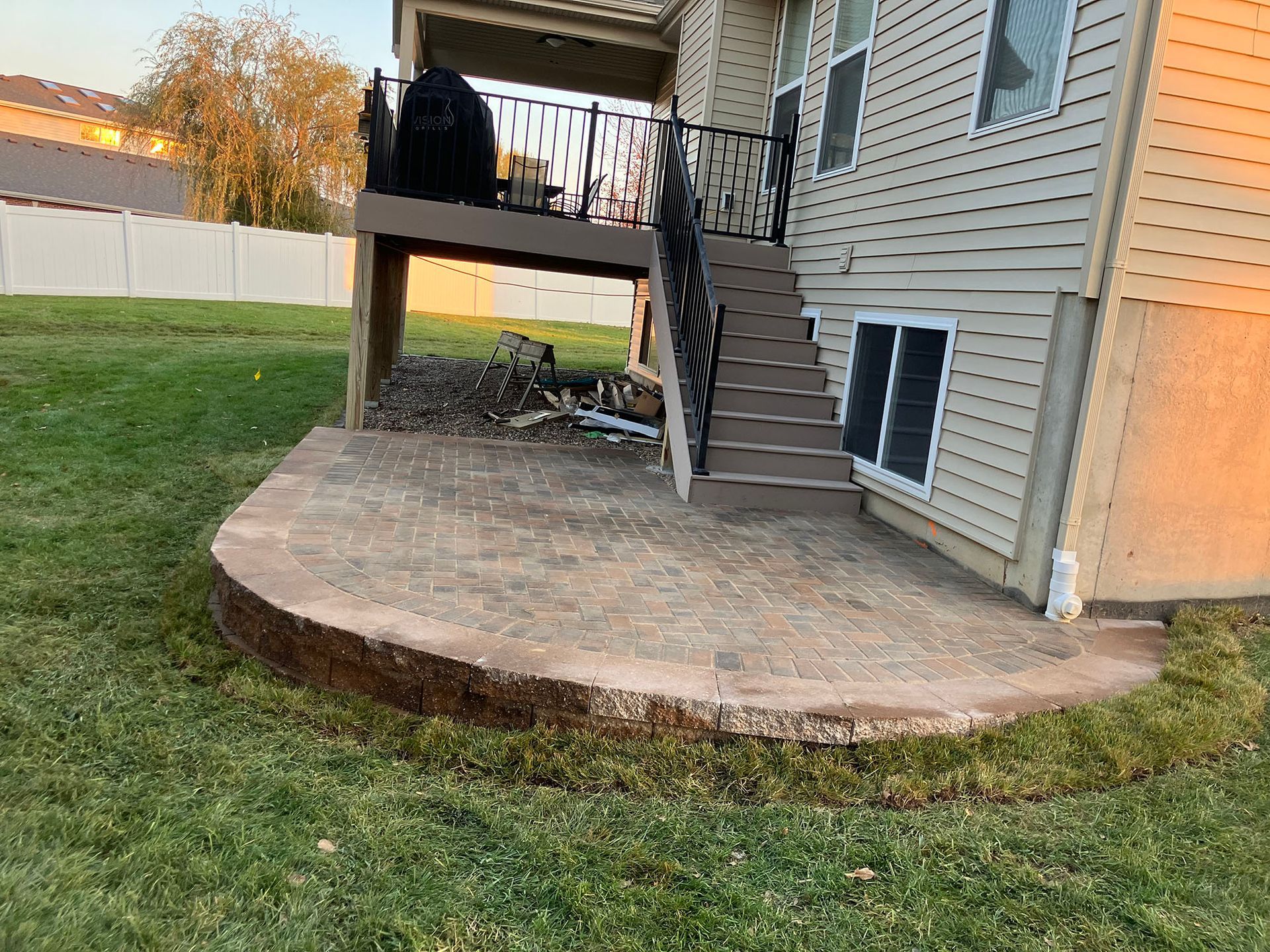 a house with a patio and stairs in the backyard