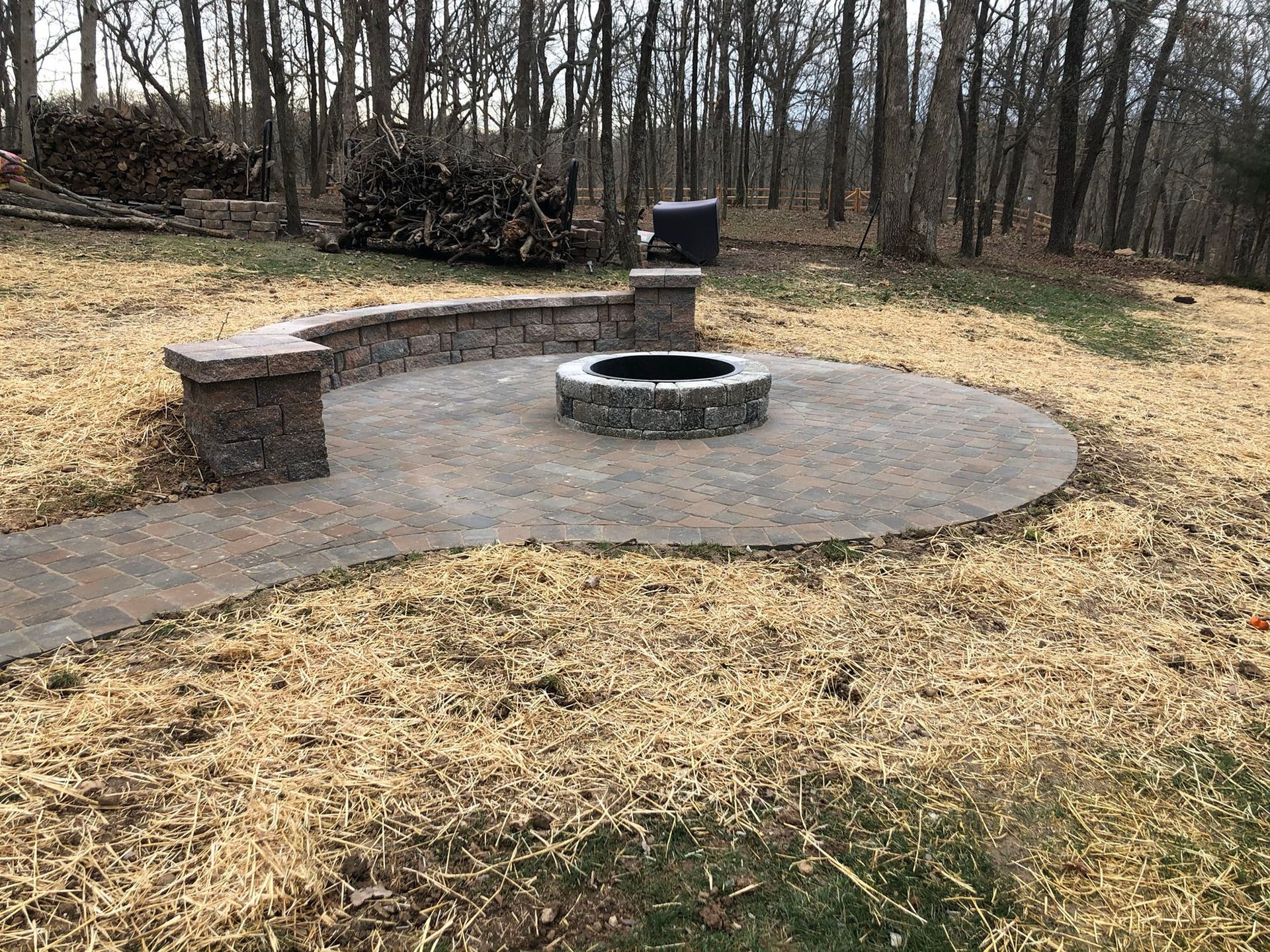 a fire pit in the middle of a patio