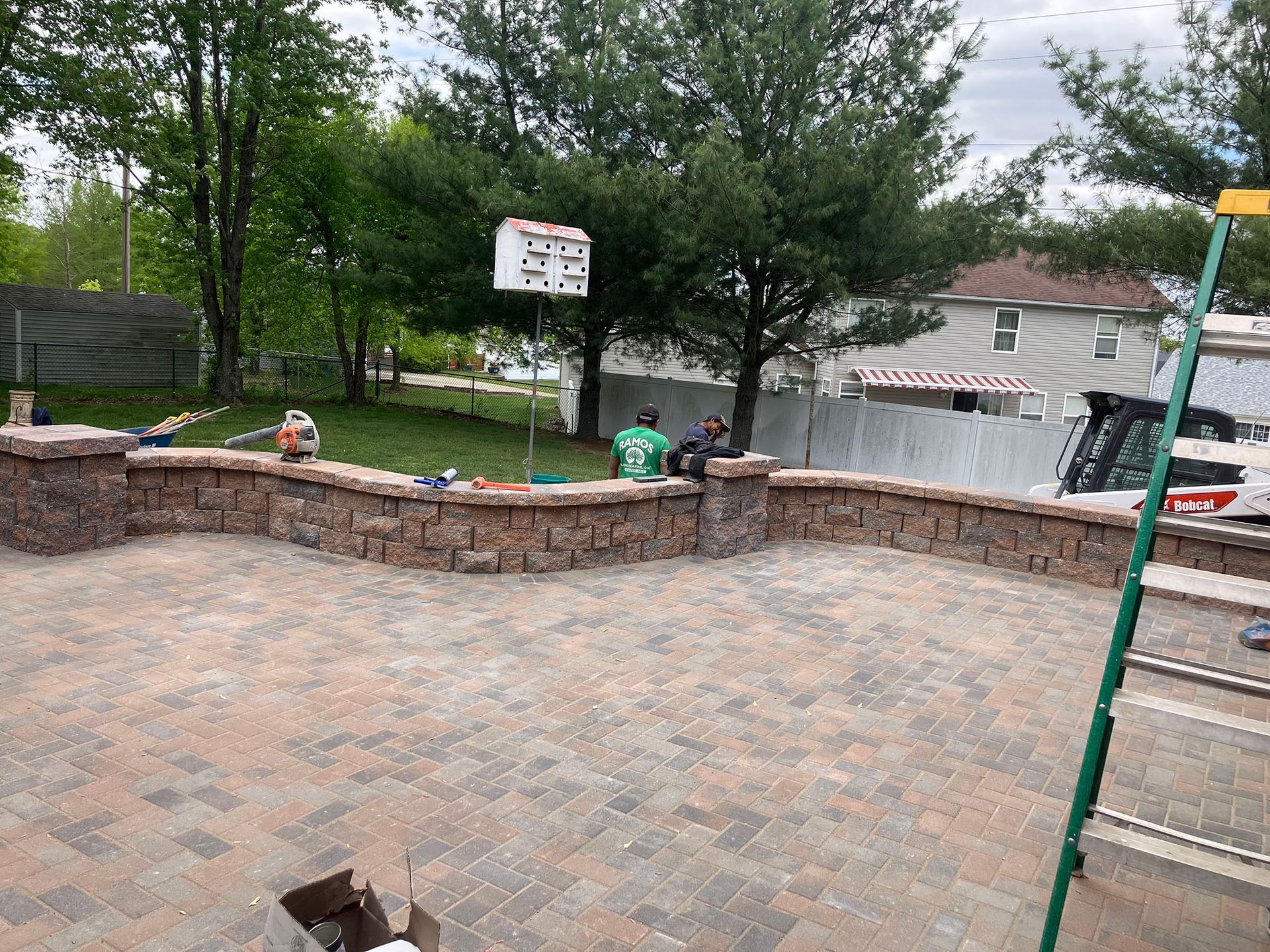 a beautiful patio with a bird house