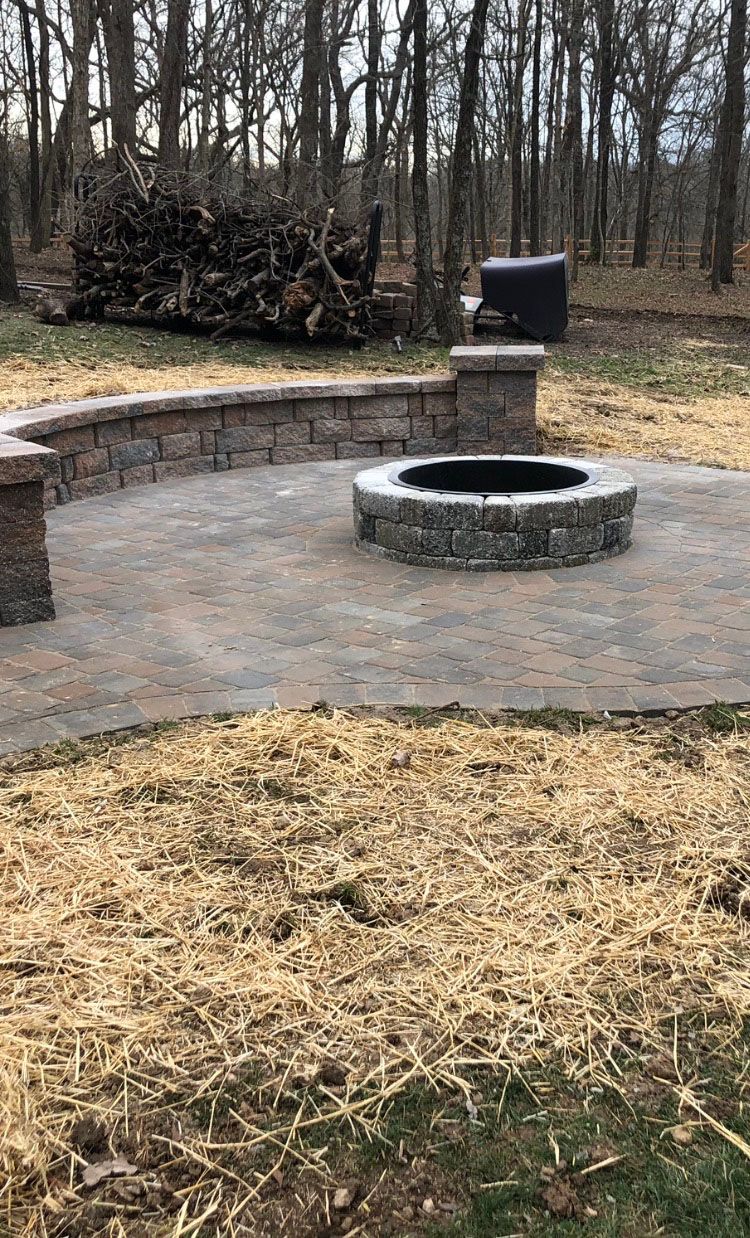 a fire pit in the middle of a patio