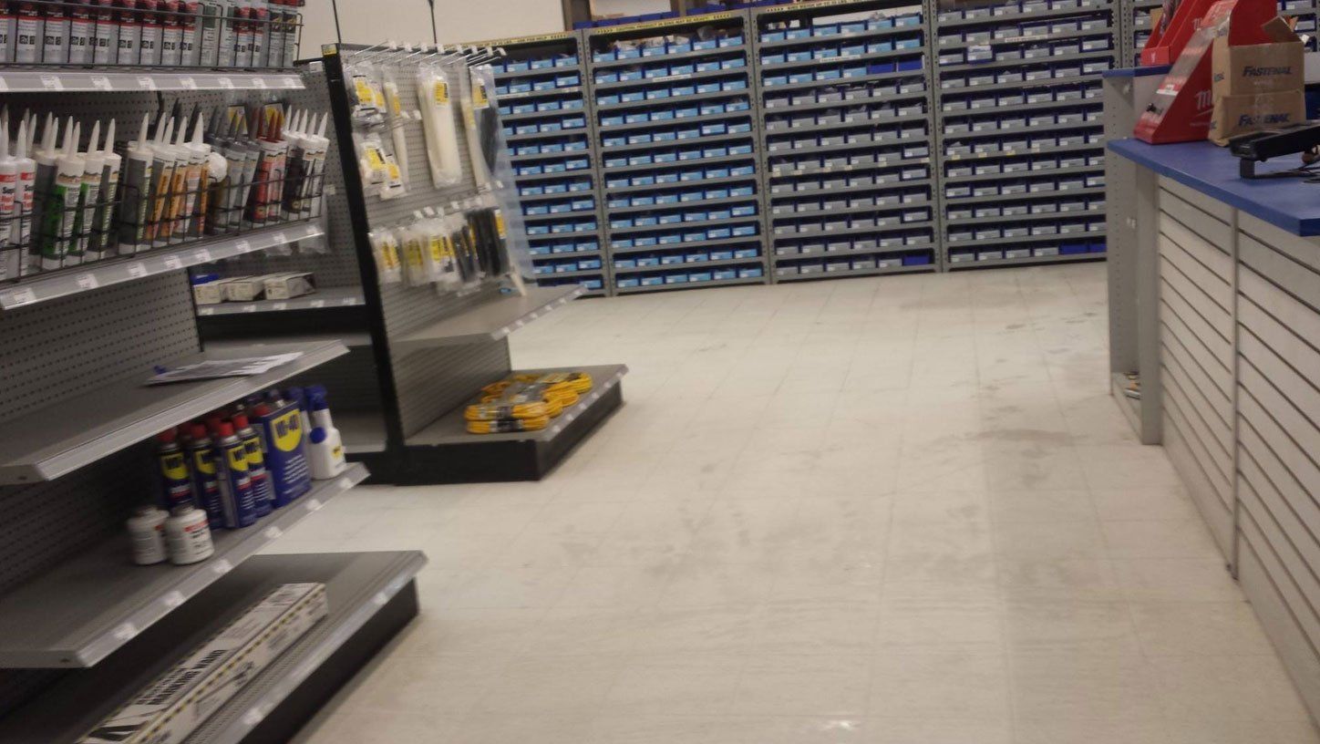 A store with a lot of shelves and a counter