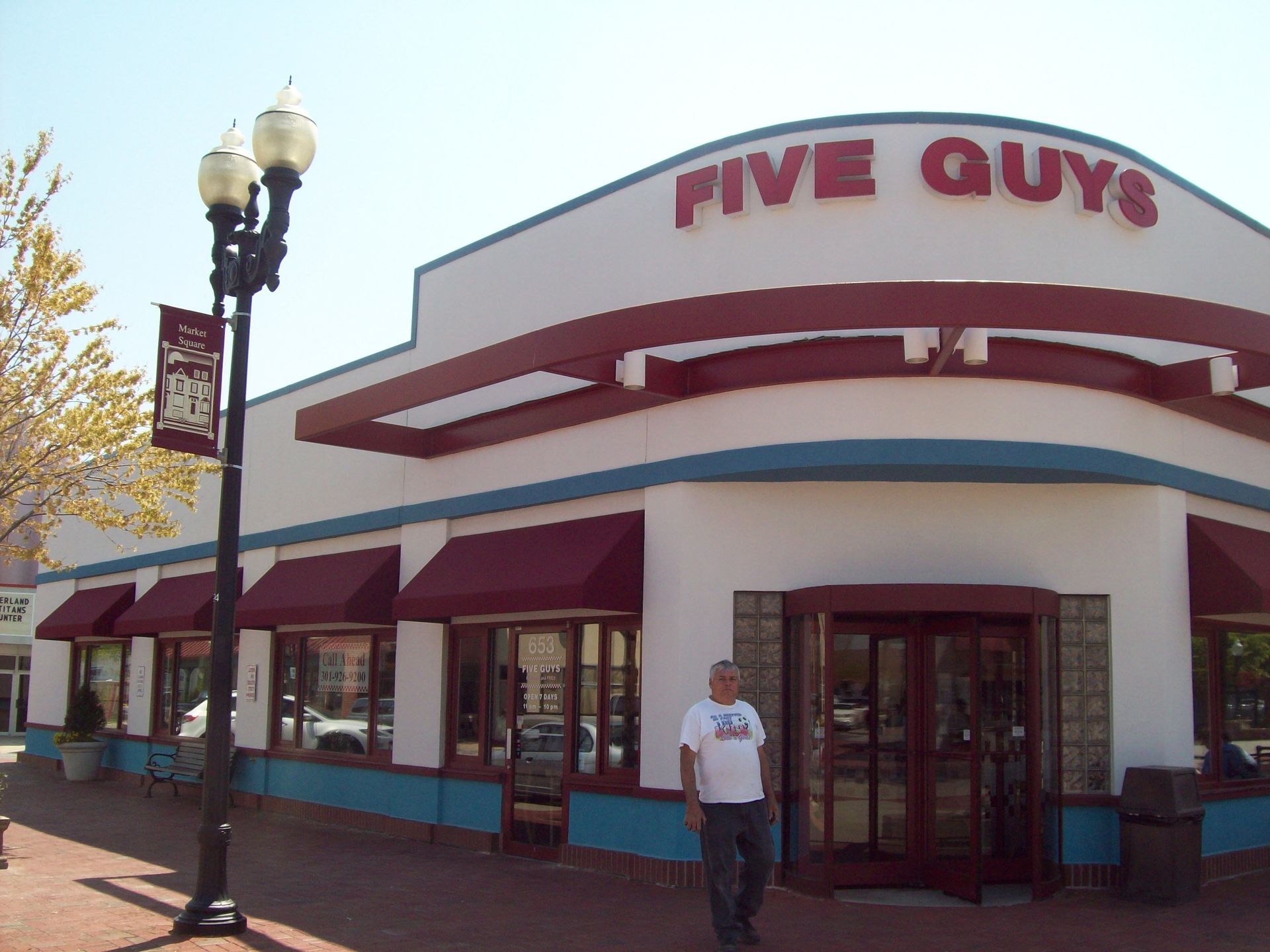 A building with a black awning