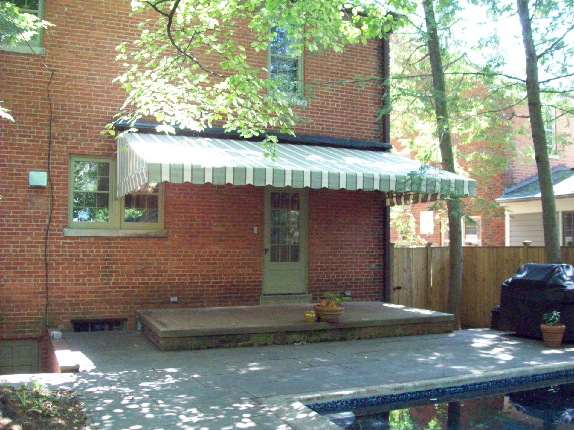 A blue canopy over the entrance to the Colony Leasing Center